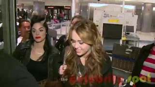 Smiling Miley Cyrus Arrives in LA