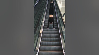 Just casually defying gravity- on an escalator