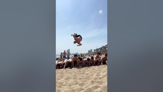 Guy Executes Side Flip Over Multiple People at Beach | People Are Awesome