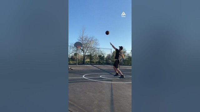 Person Catches Shoot and Scores Basket While Balancing on Slackline