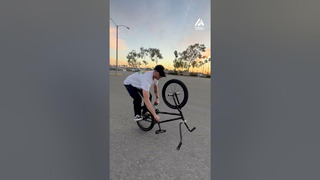 Guy Pedals With Hands While Riding Upside Down on Bike