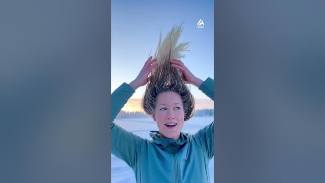 Woman Freezes Hair in Frozen Lake