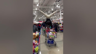 For this handstand fanatic, a shopping cart is just another opportunity to showcase his skills