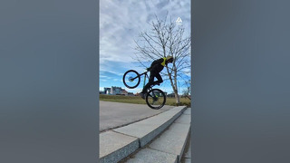 Bicyclist Wheelies Up Staircase