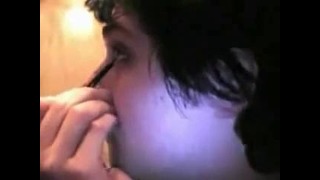Gerard Way putting on his eyeliner