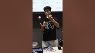 Fastest time to solve a cube whilst juggling – 13.03 seconds by Daryl Tan Hong An