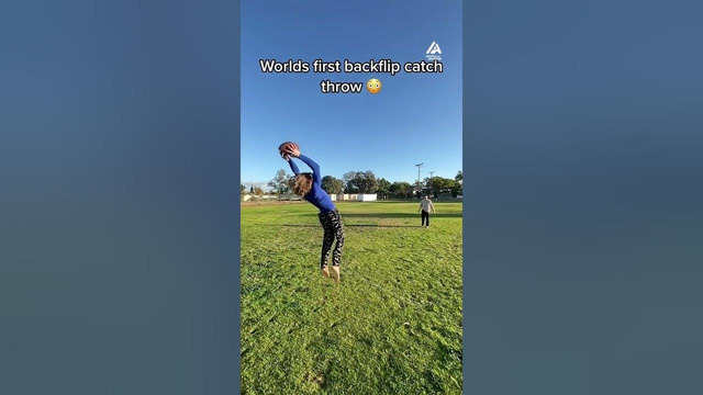 Guy Does Catch and Throw While Performing Backflip