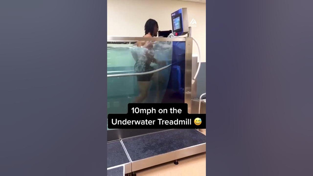 Person Watches Guy Exercise on Underwater Treadmill