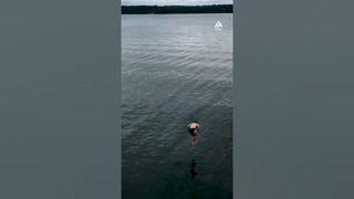 Guy Backflips Off Lakeside Slip and Slide