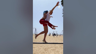 Slackliner Walks in Heels While Carrying Person on Their Back