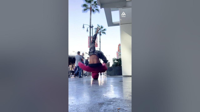 Guy Does Headstand and Spins Continuously