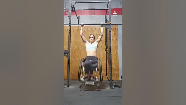 Paraplegic Athlete Does Pull ups at Gym