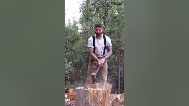 Man Slashes Woodblock With Axe