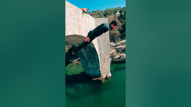 Guy Backflips Off Bridge Into Water