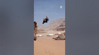 Guy Flips off Huge Rock in Desert