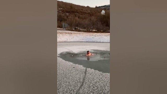 Guy Takes Dip in Frozen Lake