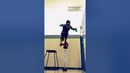 Man Squats on High Basketball with Incredible Poise
