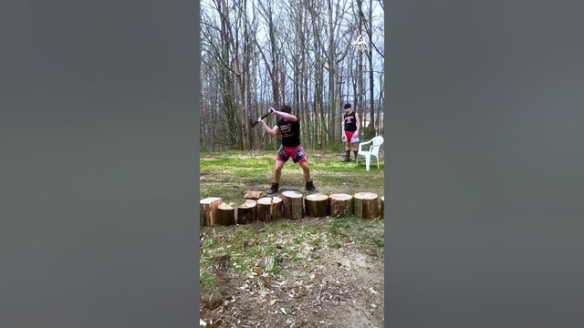 Guy Cuts Tree Stumps Into Halves With Ax Relentlessly