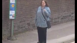 Dancing queen’ caught on camera bopping at a bus stop while listening to music on her