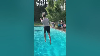 Guy Performs Header With Soccer Ball While Jumping Into Pool