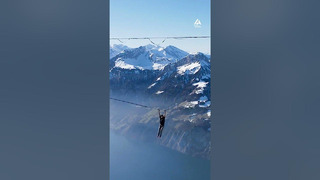 Woman Goes Slack-lining Between Two Mountains and Performs Daring Tricks