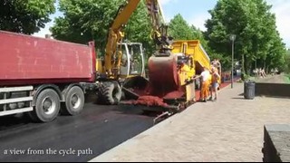 Укладка красной велосипедной дорожки в Нидерландах