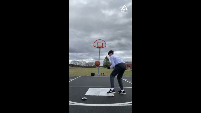 Hockey player ends trick shot series with basketball