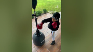 Kid Shows off Boxing Skills While Practicing on Bar