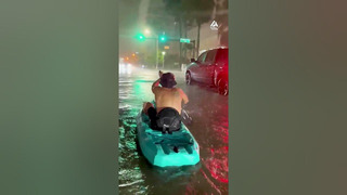 Guy Rides Kayak Through Flooded Streets | People Are Awesome