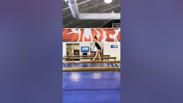 Girls Performs Wonderful Acrobatic Routine on Balance Beam