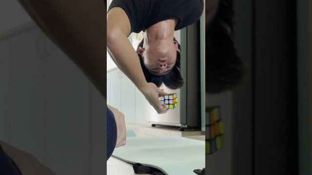 Fastest time to solve a cube one handed whilst upside down – 17.12 seconds by Daryl Tan Hong An