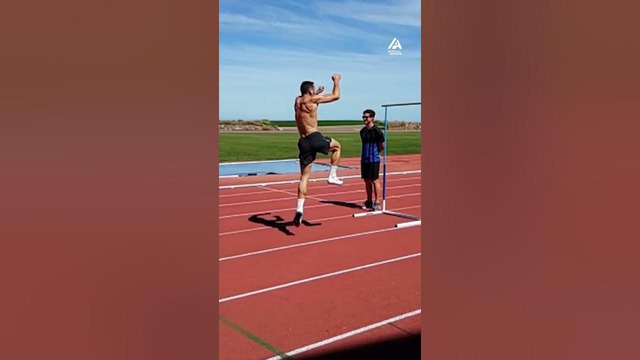 Guy Performs High Jumps Over Hurdles