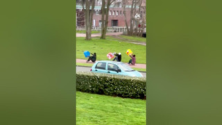 Trio Skateboards During Storm Using Plastic Bags To Propel Their Rides