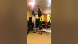 Man Impressively Jumps on Stack of Weights Almost High as Himself