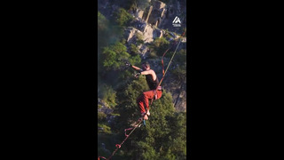 Man Performs Flips on Slack Line Mid-Air | People Are Awesome