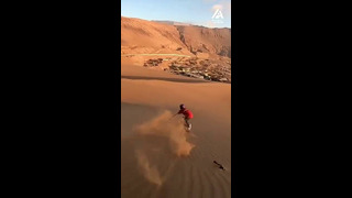 Sandboarding in Chile at sunset