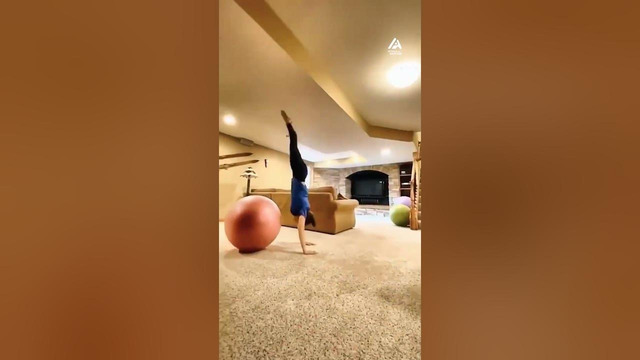 Girl Performs Unique Flips and Rolls Using Exercise Balls