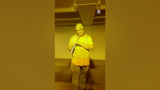 Ironworker Shows Amazing Talent While Playing Flute At Parking Ramp