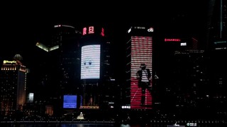 Chinese fans dance with giant Michael Jackson screen in Shanghai