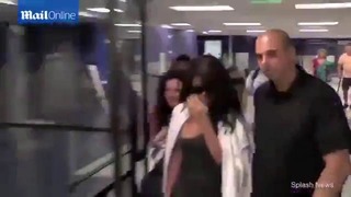 Selena Gomez Returns To LA In Grey Dress