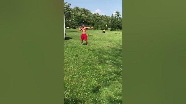 Man Catches Football With a Spear Mid Air