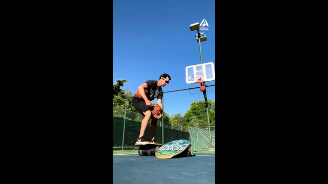 Guy Balances on 2 Roller Boards While Shooting Basketballs | People Are Awesome