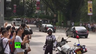 Cops and limos- Convoy presumably carrying Kim drives through Singapore