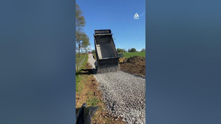 Spreading Gravel on Landscaping Fabric With Dump Truck | People Are Awesome