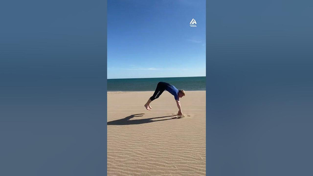 Person Performs Multiple Flips on Picturesque Beach