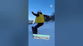 Person Executes Multiple Tricks While Snowboarding