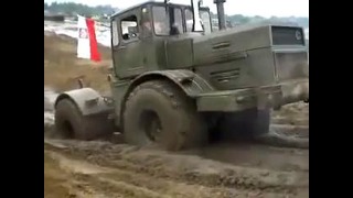 Russian monster tractor Kirovets K-700 rides through the mud