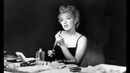 Marilyn Monroe – Putting on Make up Backstage, By Sam Shaw 1954