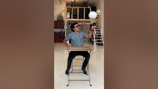 Guy Balances Spinning Ball On Different Household Objects